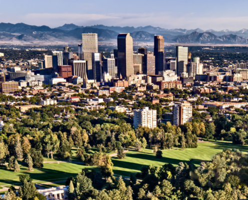 Rocky Mountain Denver Colorado Skyline From The Air With Cheesman Park In The Forground The Flatirons In The Background