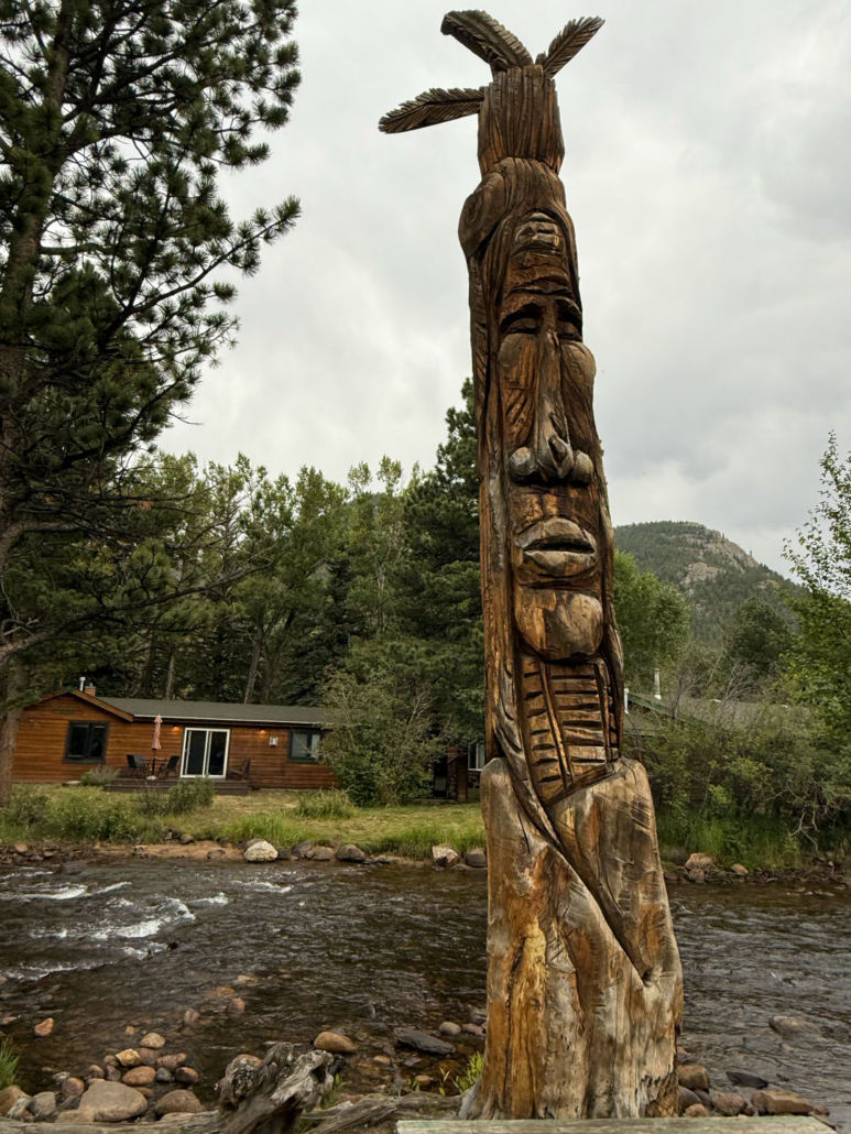 Rocky_Mountain-totem-pole-by-river Rocky Mountain Totem Pole By River
