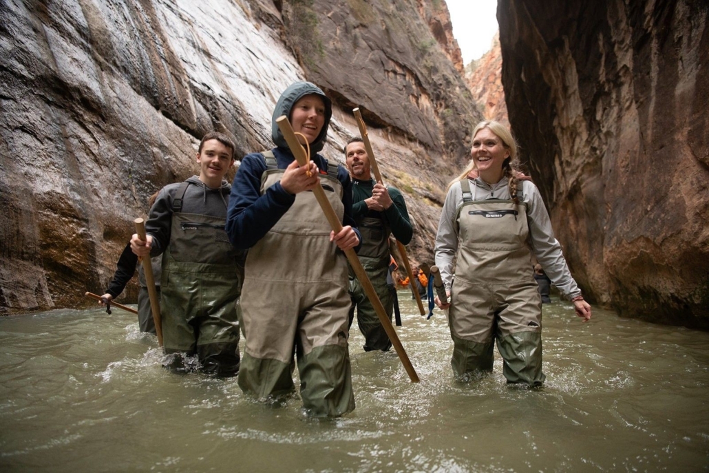 a, group, of, friends, walking, through, narrow, canyon Allwaysadventure A Group Of Friends Walking