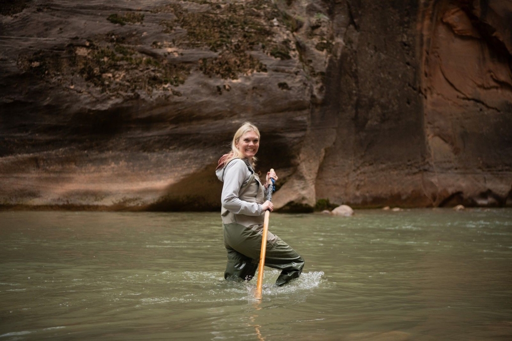 a, woman, wading, through, water, while, smiling Allwaysadventure A Woman Wading Through Water