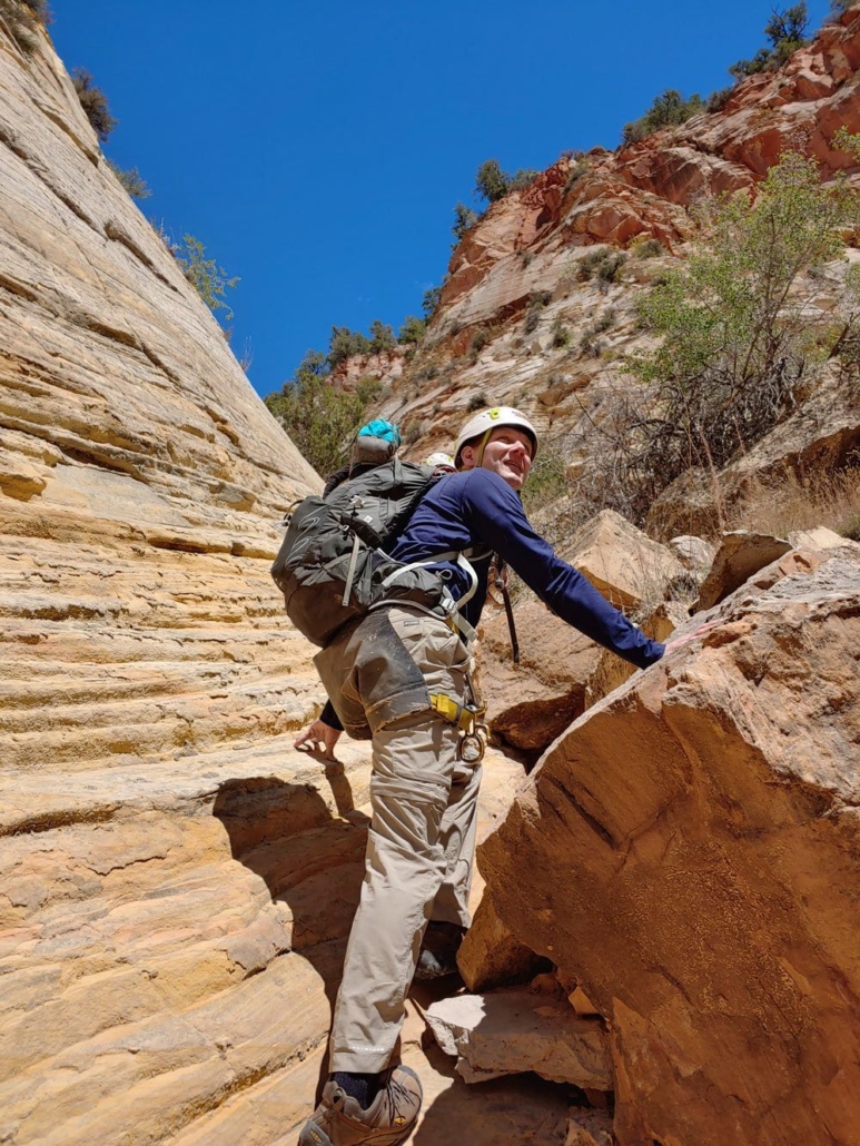 Hiking: The Zion Narrows — Zion Allwaysadventure Hiker Scaling Rocks Zion Narrows