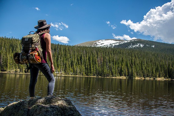 stylish, suv, parked, in, a, scenic Aspire Tours Hiker On Rock At Lake Looking At Snowy Peak