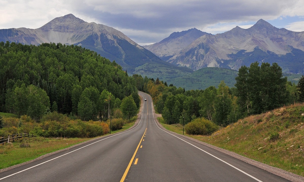 aspire-tours-lonely-highway-heading-into-mountains Aspire Tours Lonely Highway Heading Into Mountains