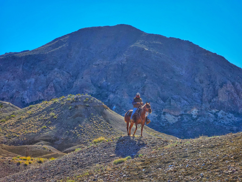 bigbendstables_horseback-rider-mountainous-terrain Bigbendstables Horseback Rider Mountainous Terrain