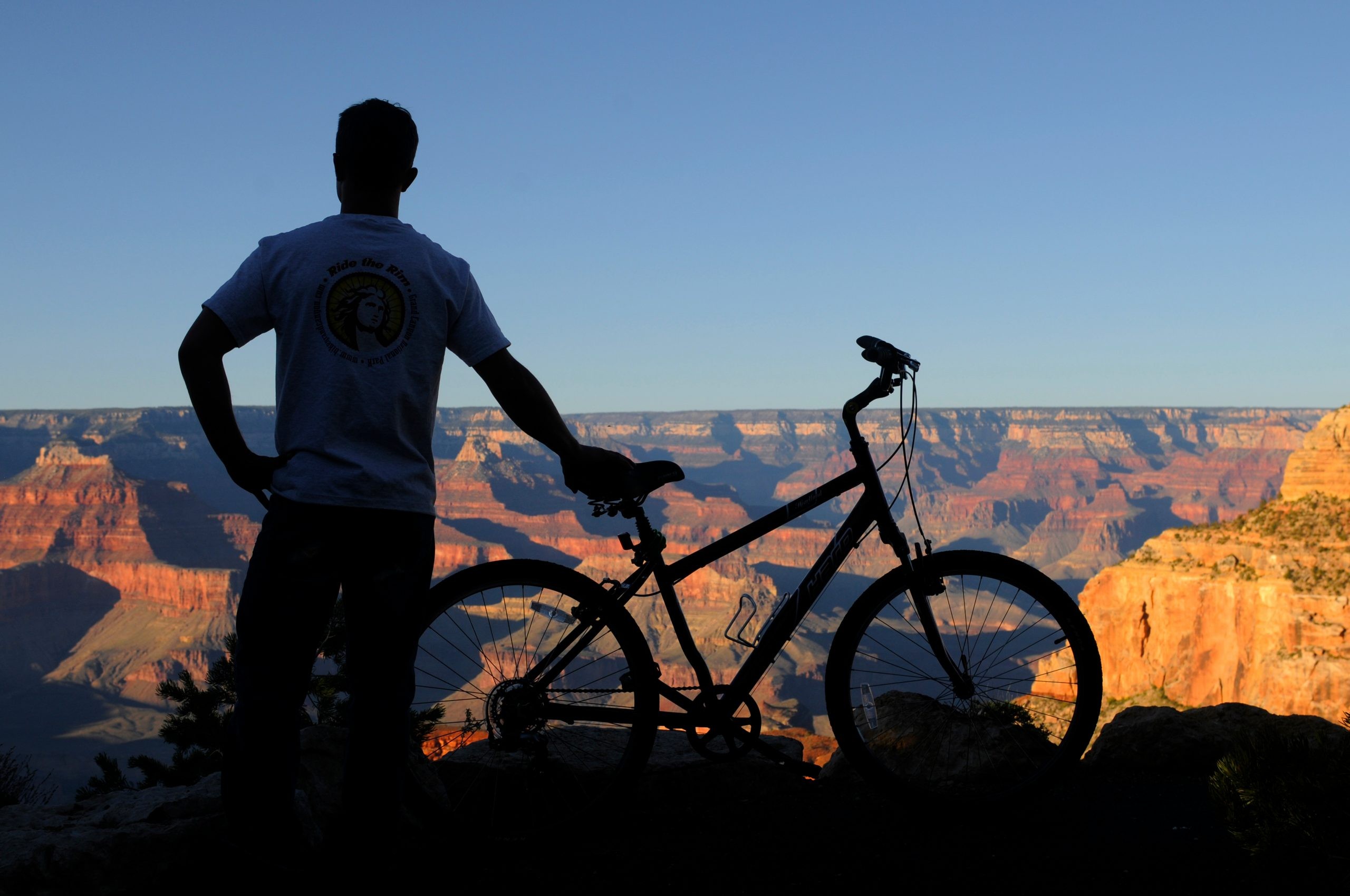 a, cyclist, overlooking, the, grand, canyon Bikegrandcanyon A Cyclist Overlooking The Grand