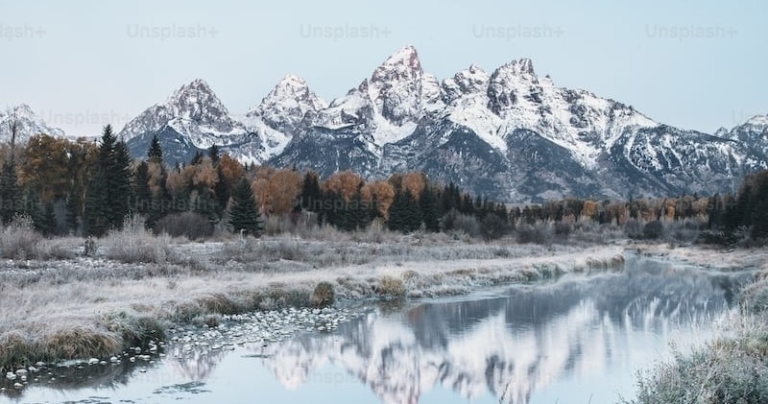 Brushbucktours Mountains Reflecting On A Tranquil