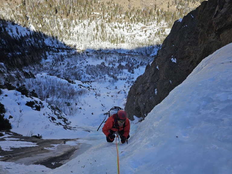 a, group, of, climbers, nearing, the, summit Coclimbing A Climber On Ice Cliff With Pick Scaled