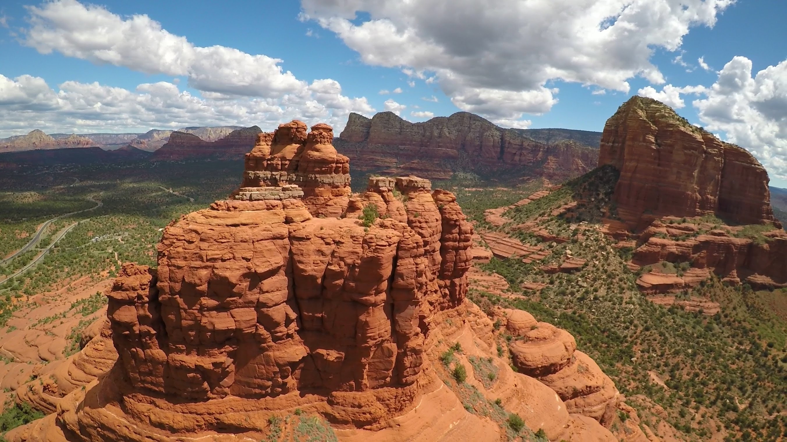 coexistwestcoast_red-rock-formations-cloudy-sky Coexistwestcoast Red Rock Formations Cloudy Sky Scaled