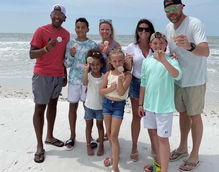 a, group, of, people, showing, off, their, beach, finds Everglades Boattours A Group Of People Showing
