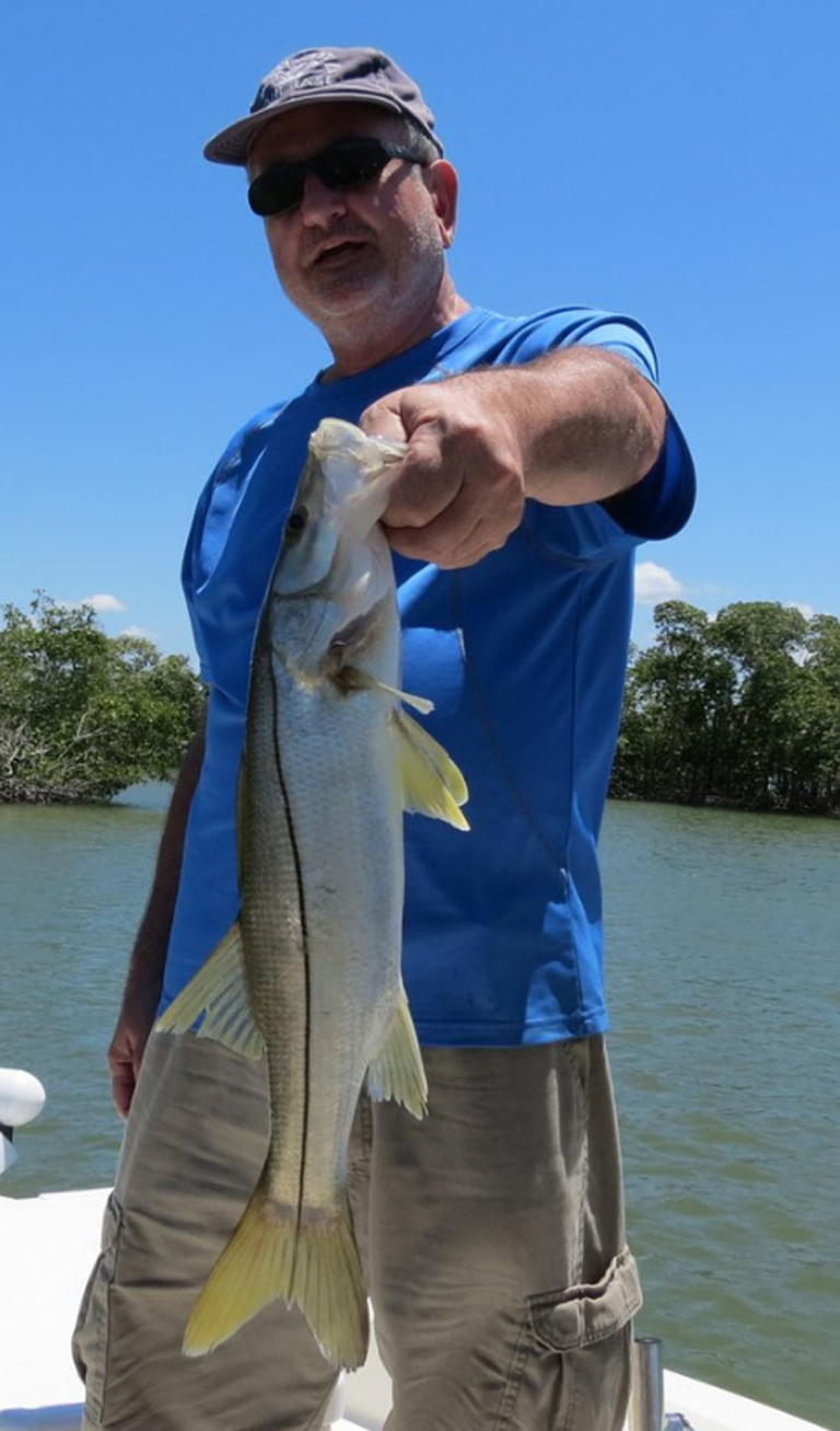 evergladescityfishingcharters-a-young-boy-excitedly-holding Evergladescityfishingcharters A Young Boy Excitedly Holding
