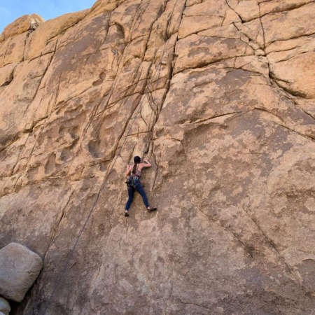 Joshuatreeexcursions A Climber Scaling Rock Face