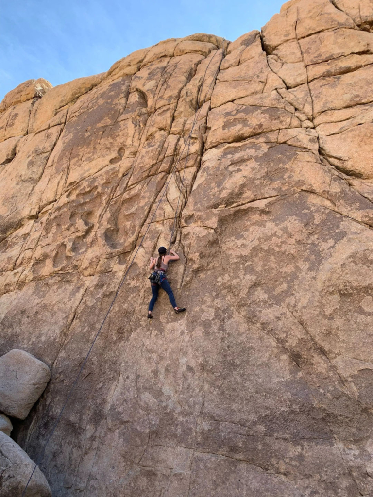 a, climber, scaling, rock, face Joshuatreeexcursions A Climber Scaling Rock Face
