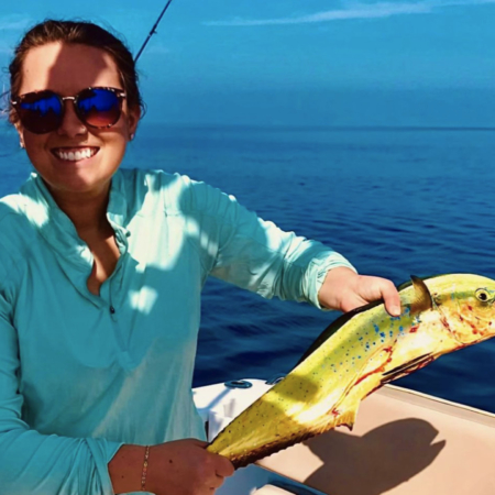 Redkeyfishingcharters Woman Holds Fish On Boat