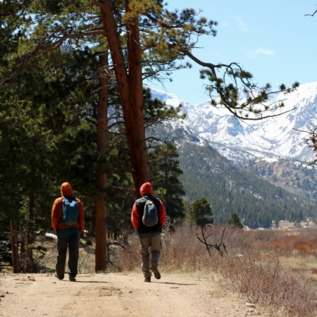 Rockyguides Hikers Following Path Towards Snowy Mountains