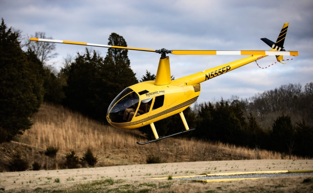 a, yellow, helicopter, taking, off Scenichelicoptertours A Yellow Helicopter Taking Off