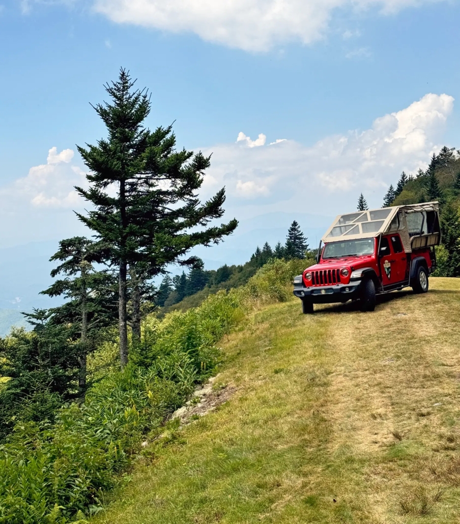 a, jeep, parked, on, mountain, ridge, with, scenic, views Scenictoursandadventures A Jeep Parked On Mountain