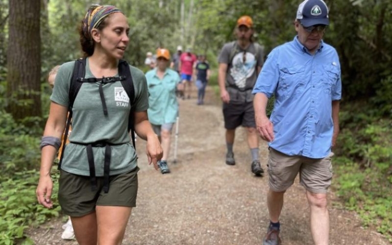 hikers enjoying nature, on, a, scenic, trail hikers enjoying nature on a scenic trail