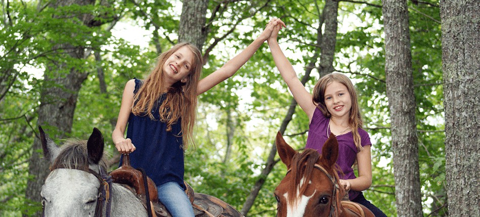 two, girls, celebrating, their, friendship, on, horseback Smokymountaintrailrides Two Girls Celebrating Their Friendship