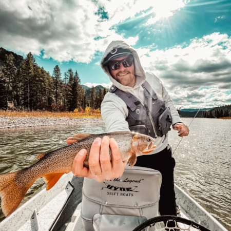 Tetontroutfitters Angler Holding Trout Snake River