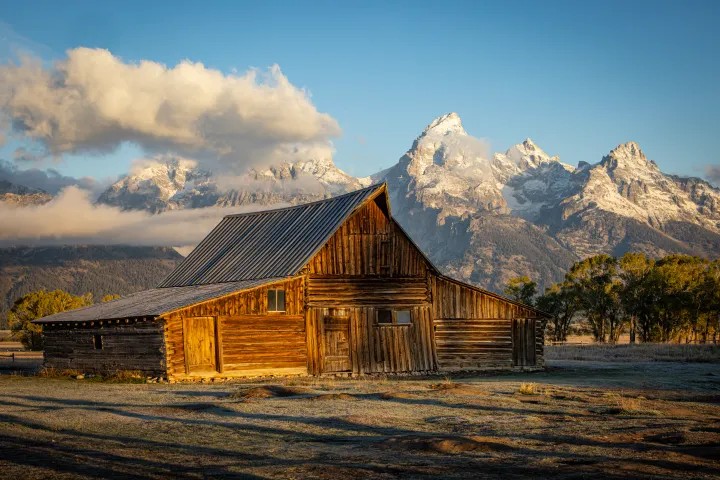 a, charming, wooden, barn, illuminated, by, morning, light Tetonwildernesstours A Charming Wooden Barn Illuminated