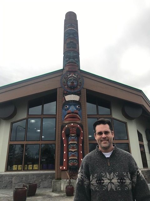 a, person, standing, by, totem Toursofseattle A Person Standing By Totem