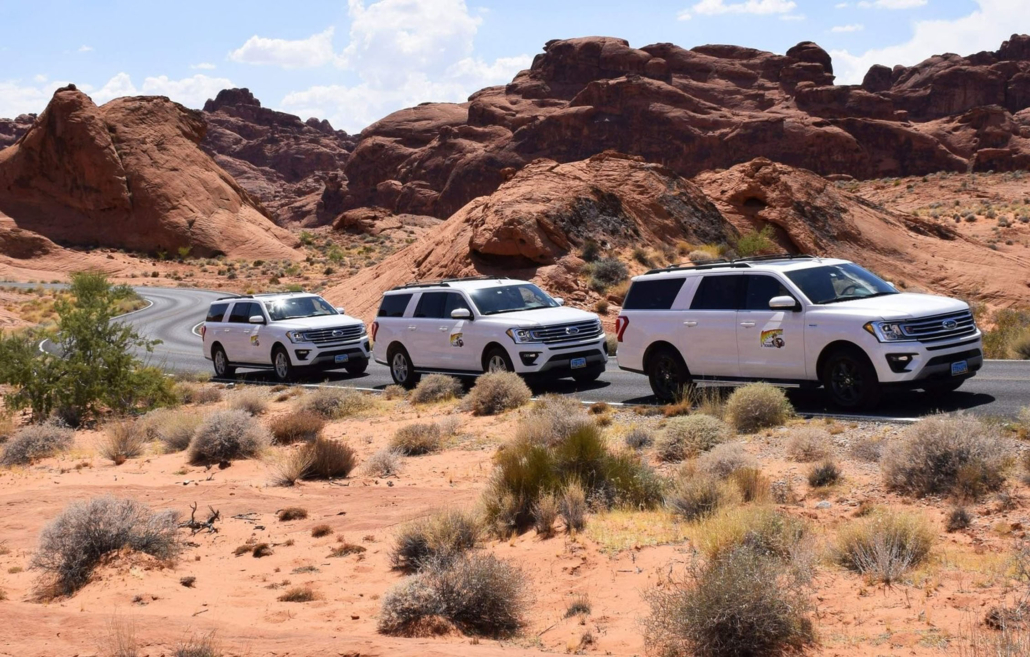 vegassightseeing-three-suvs-driving-through-a Vegassightseeing Three Suvs Driving Through A