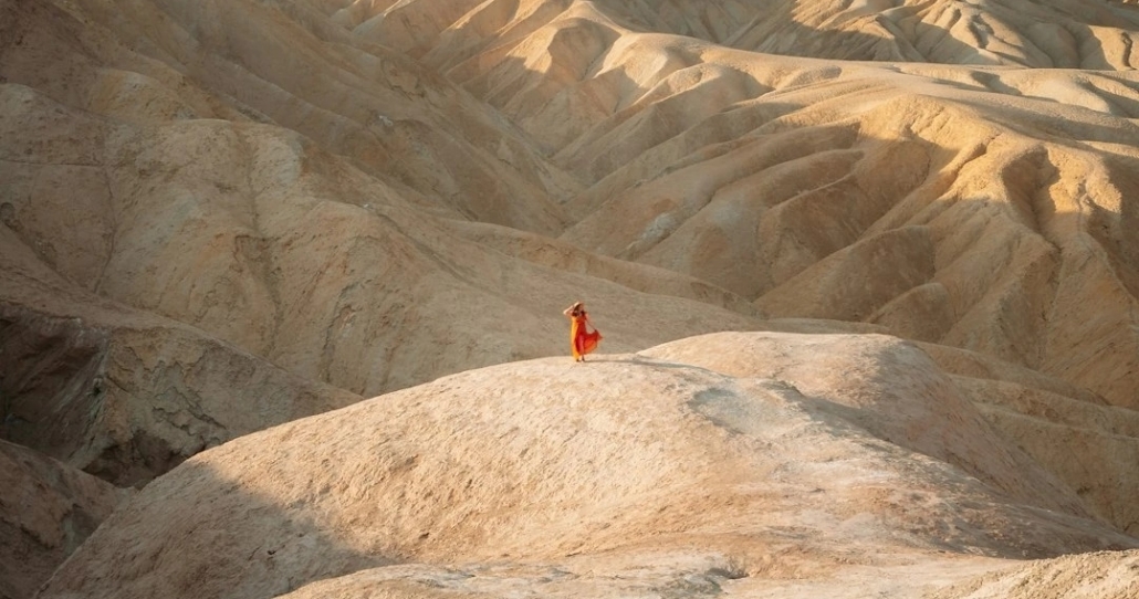 Unveiling the Wonders of Death Valley on Our Epic Expedition — Death Valley Vegastoursandrides Woman Red Dress Desert Hills