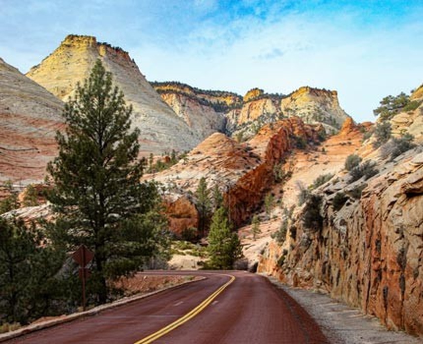 Vermillioncliffs Road With Cliff Along Pavement
