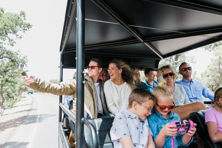 westwindairservice-group-enjoying-open-air-tour-vehicle Westwindairservice Group Enjoying Open Air Tour Vehicle