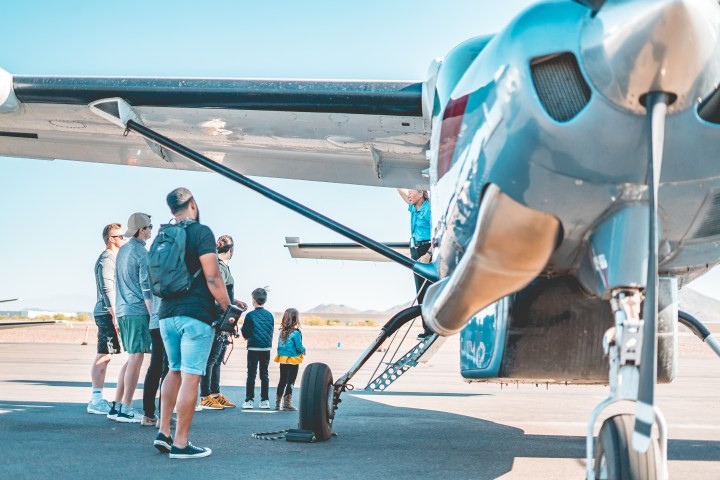 passengers, observing, the, aircraft, before, boarding Westwindairservice Passengers Observing The Aircraft Before