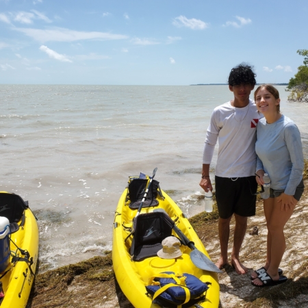 Wildlimeadventures Kayakers At Play Amidst Serene Scaled
