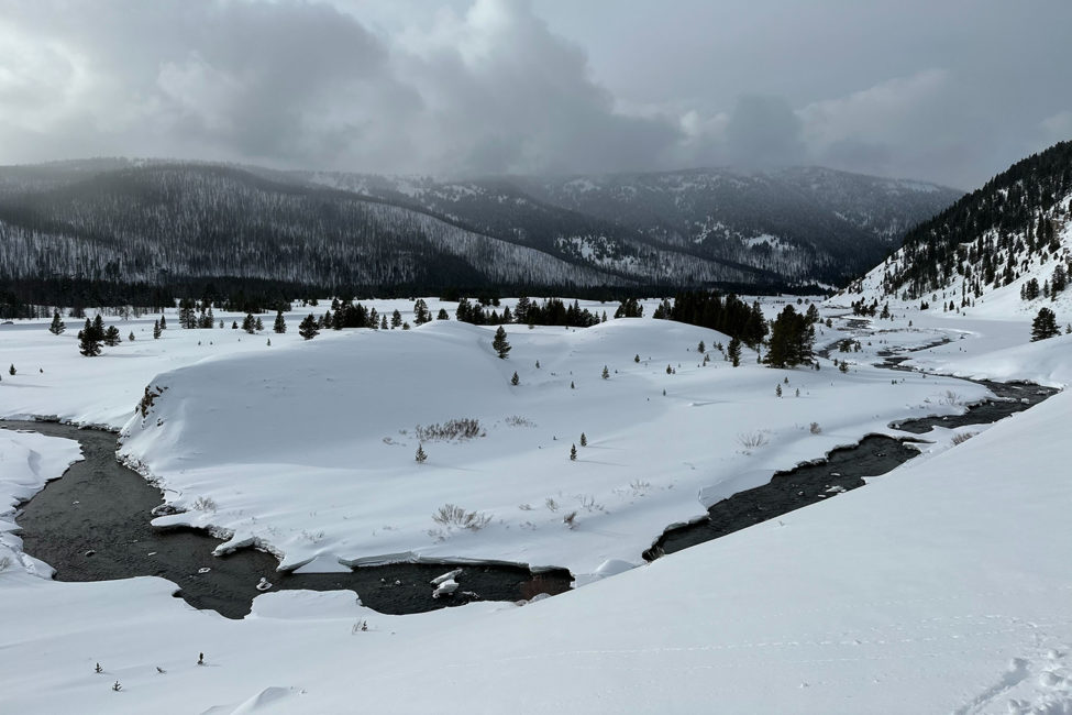 Big Sky Snowshoe Safari - Half Day - Private Tour — Yellowstone Yellowstonesafari Snow Covered Hills River Yellowstone