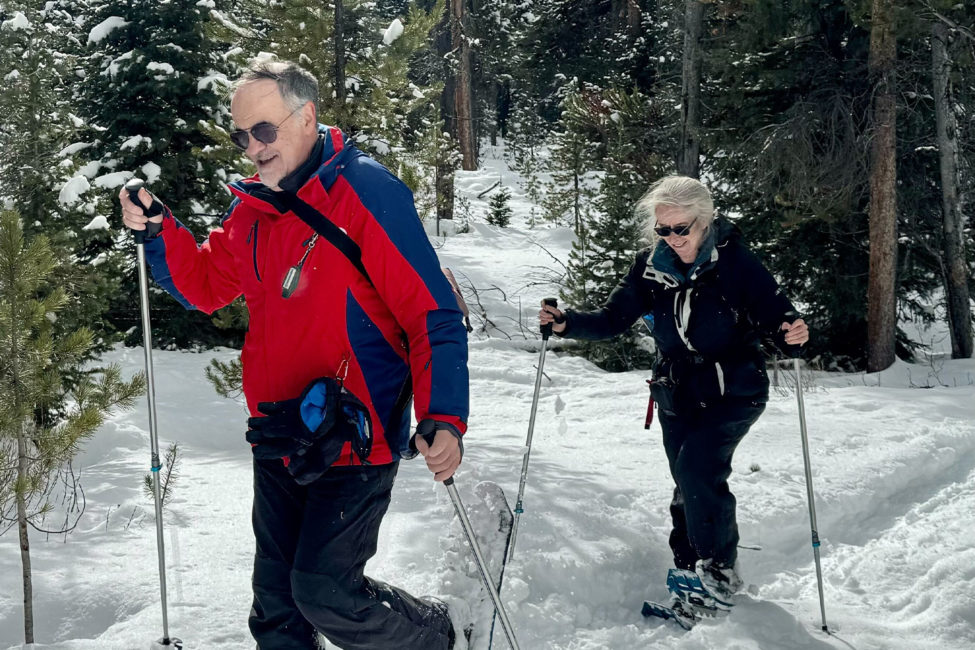 Big Sky Snowshoe Safari - Half Day - Private Tour — Yellowstone Yellowstonesafari Snowshoeing Couple Forest Path