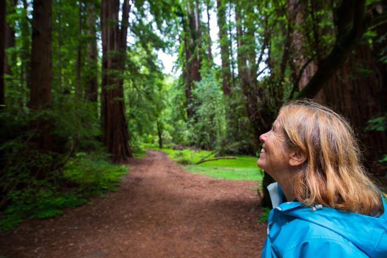 Muir Woods Redwood Forest and Sausalito with Park Admission — Redwood Yosemite Tours Woman Smiling Redwood Forest Path