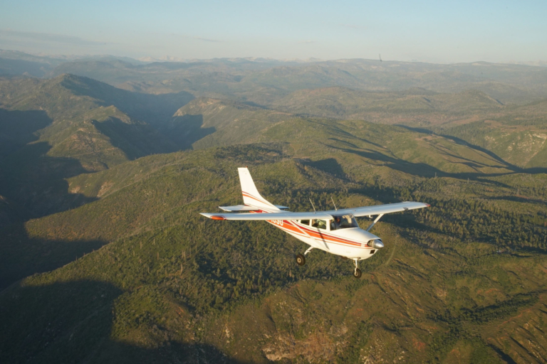 yosemiteflights-cessna-flying-over-green-hills Yosemiteflights Cessna Flying Over Green Hills