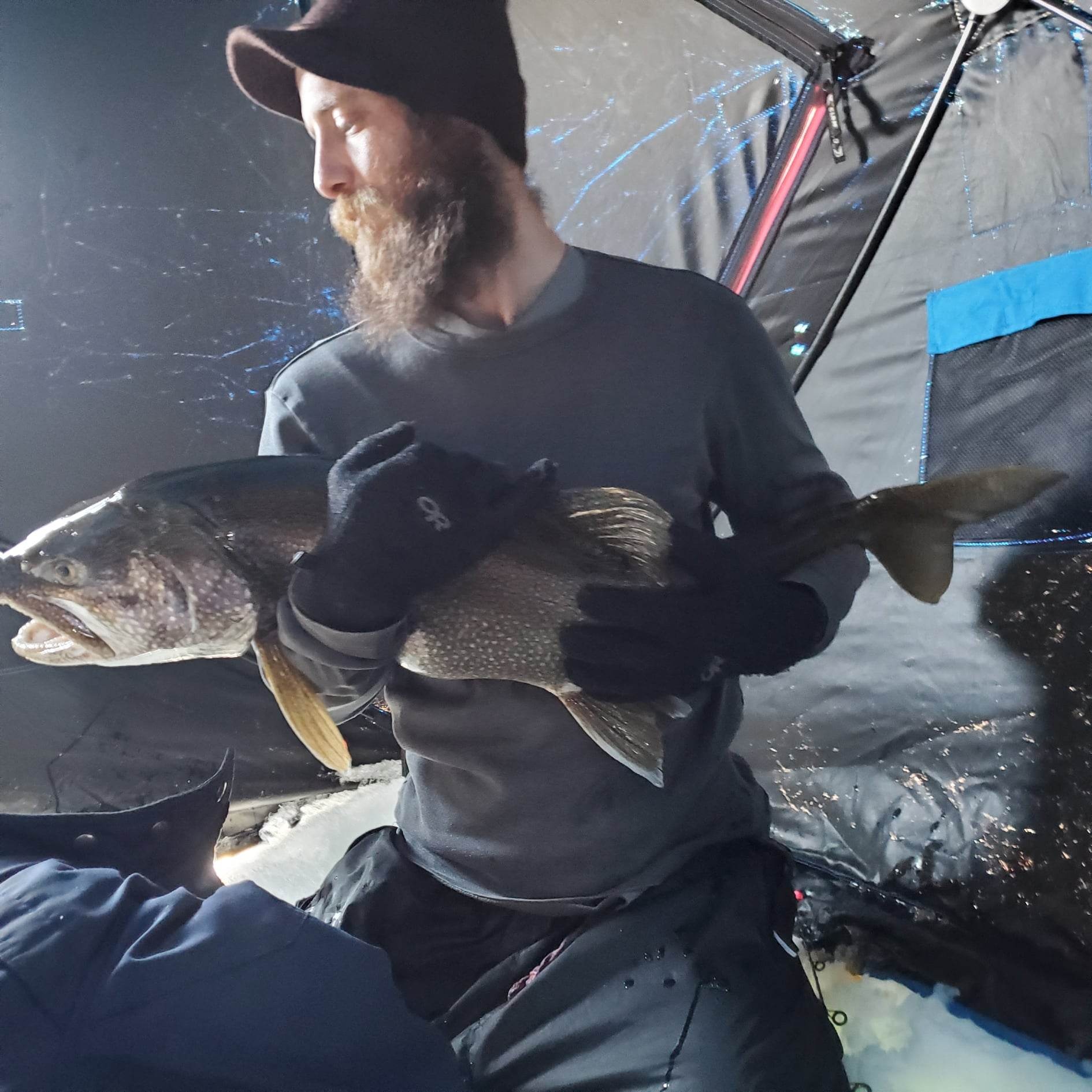 fishingwithbernie_grand-lake-ice-fishing-private-guided-ch-ice-fishing-man-holding-fish