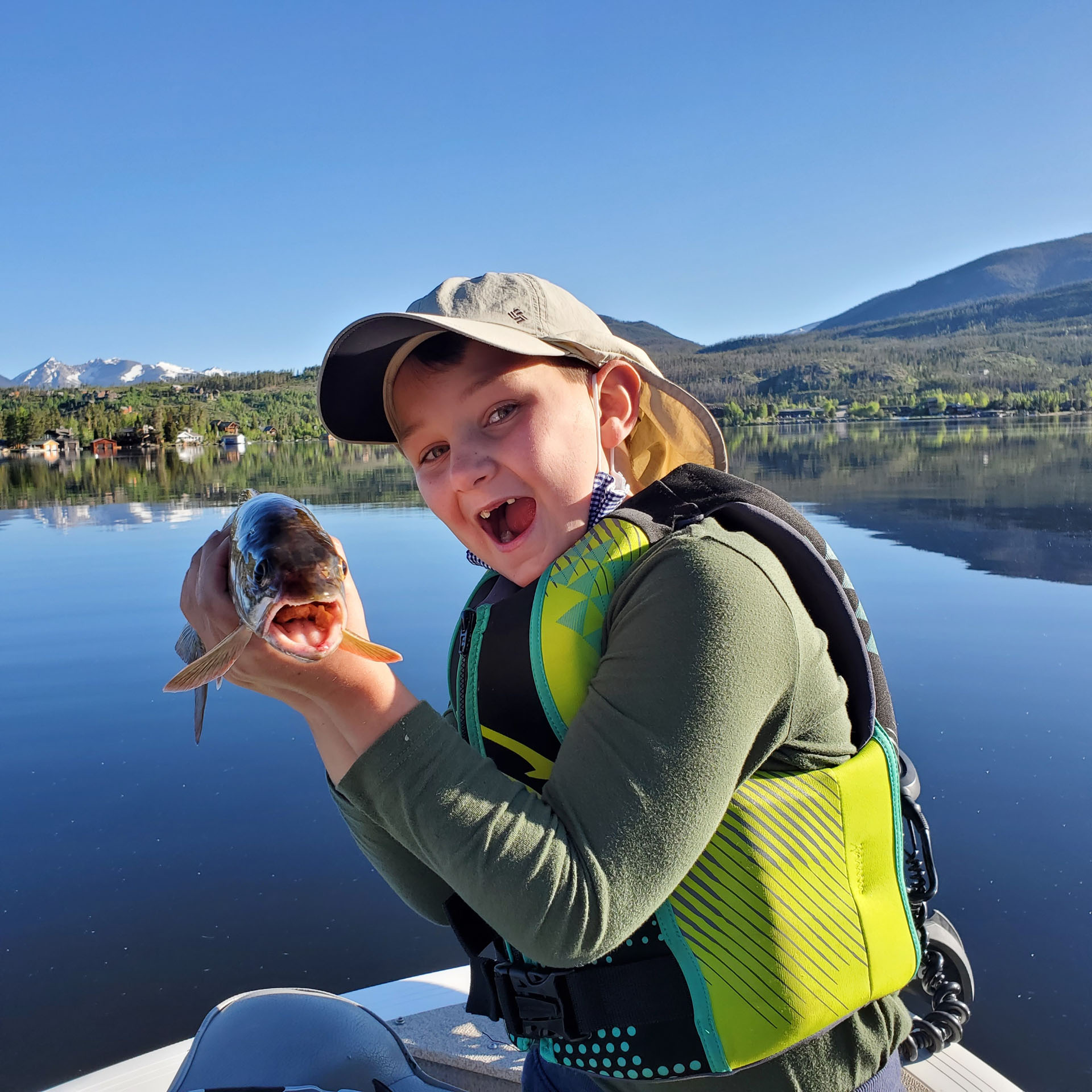 fishingwithbernie_grand-lake-open-water-fishing-private-gu-boy-fishing-lake-mountain-background