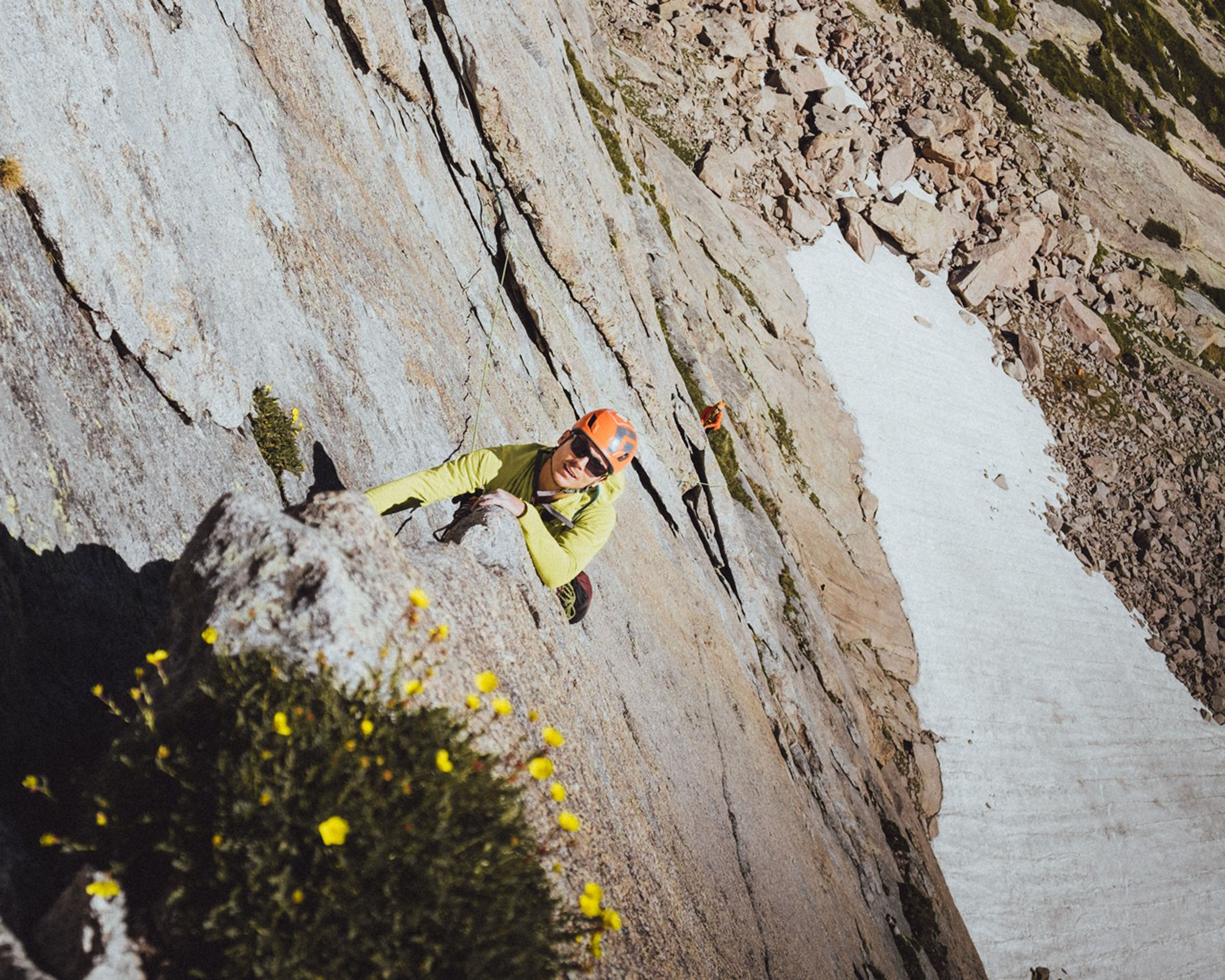 kmaconline_multi-pitch-rock-climbing-rock-climber-yellow-helmet-flower-2