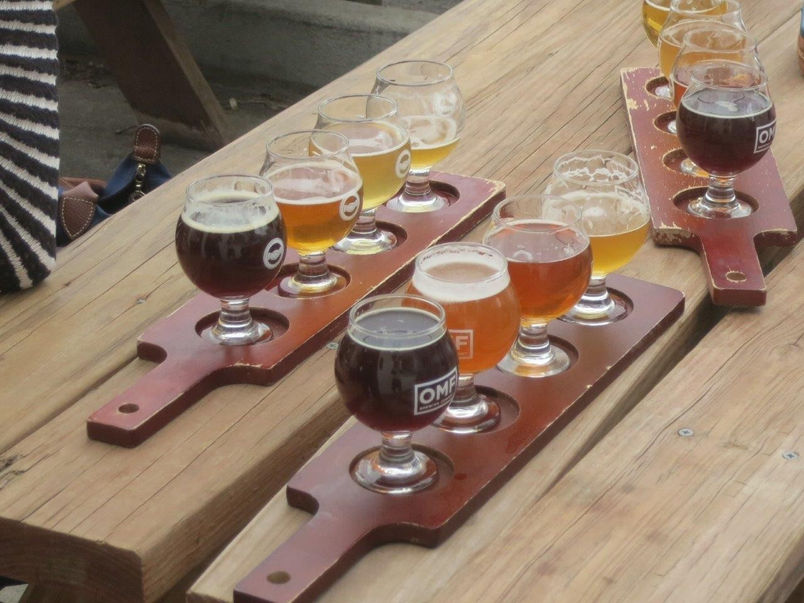 milehighbiketours_bike-brew-tour-beer-flight-wooden-table