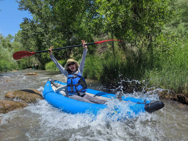 oactours_boats-burgers-beer-kayaker-blue-kayak-splashing-water
