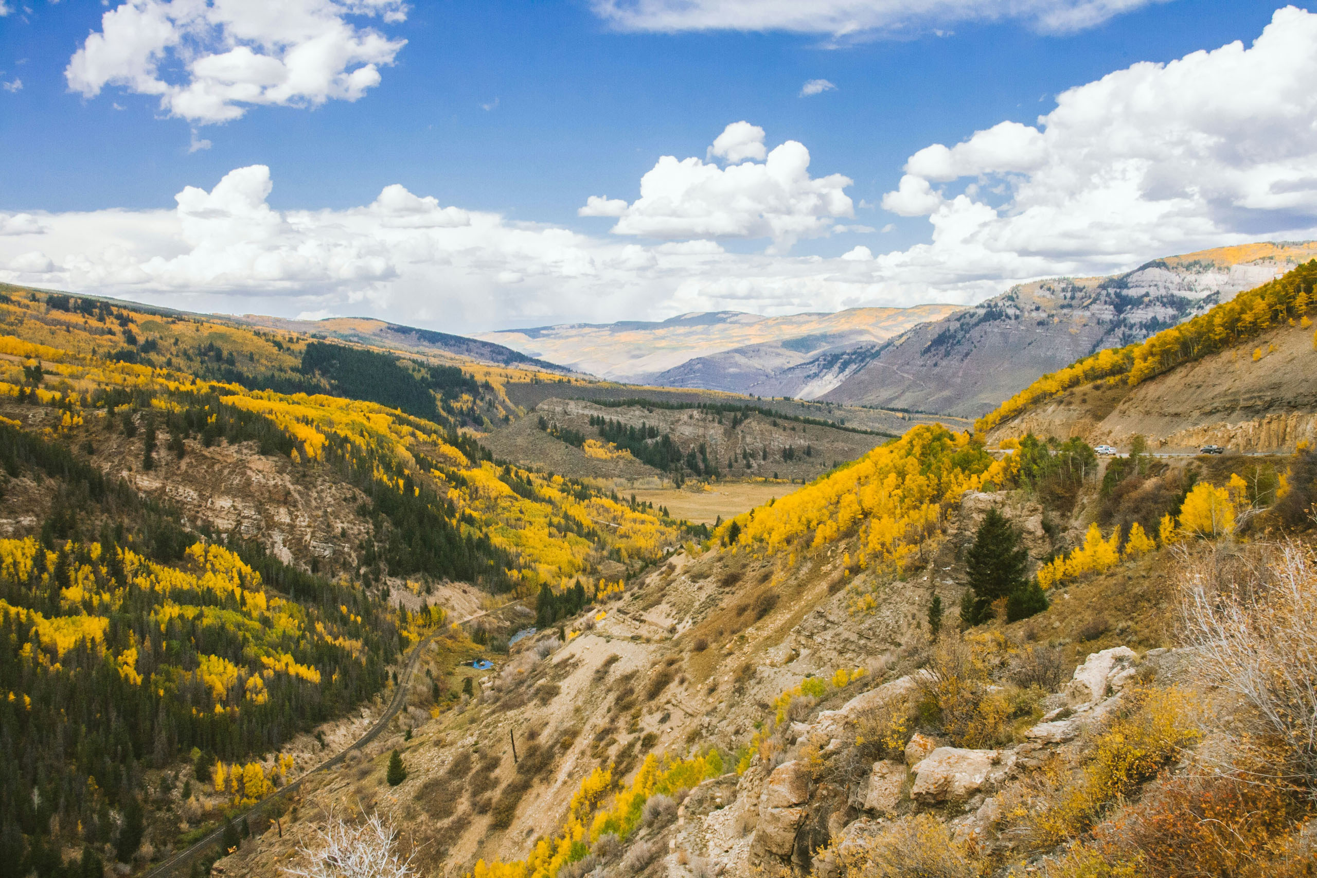scout-co_seven-falls-and-garden-of-the-gods-golden-aspen-forests-mountainous-landscape