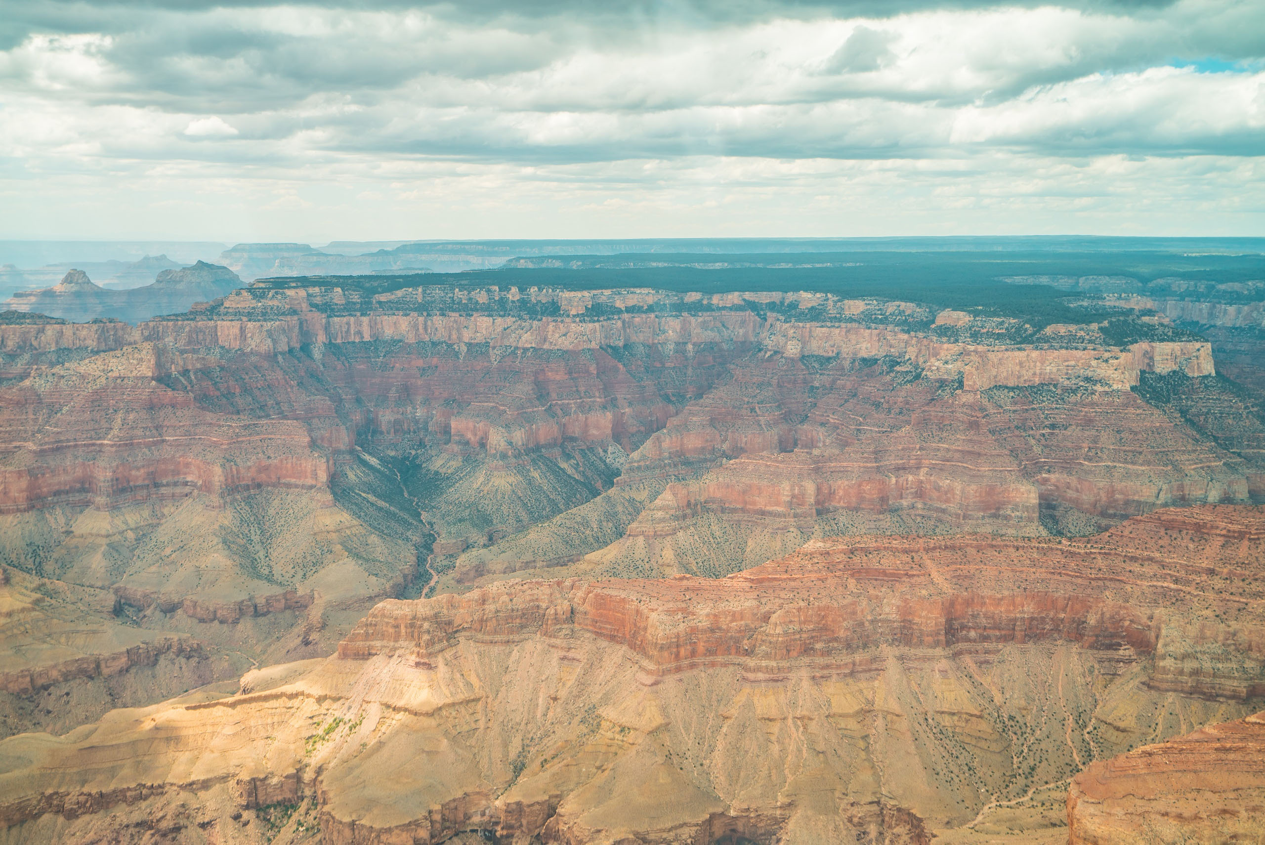 westwindairservice_ultimate-tour-of-northern-arizona-from-f-grand-canyon-layered-rocks-cloudy-sk
